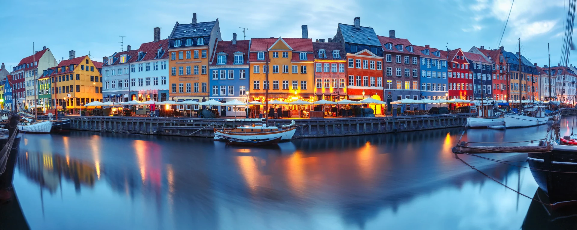 Colourful Nyhavn waterfront in Copenhagen at blue hour